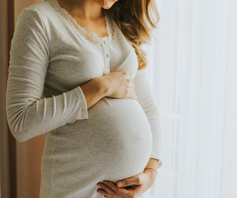 Expectant mother receiving a prenatal massage on a pregnancy cushion at New Beginnings near Reading, PA