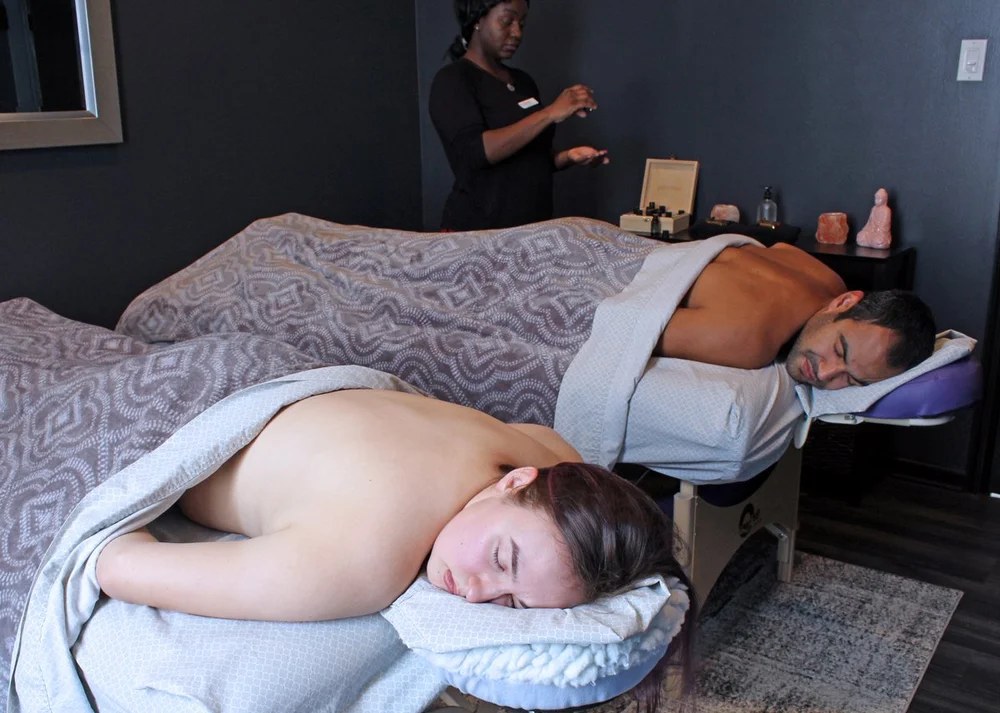 Couple receiving a side-by-side couples massage at New Beginnings in Wyomissing, PA